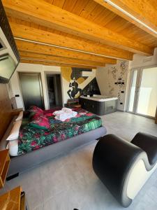a bedroom with a large bed in a room with wooden ceilings at Bed & Breakfast dei sogni in Ascoli Piceno +22 photos