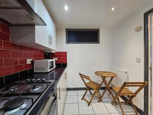 Kuchyň nebo kuchyňský kout v ubytování Modern Home - Whitechapel