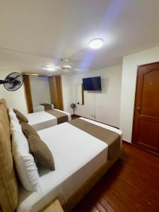 Voodi või voodid majutusasutuse Hotel Pereira Central toas