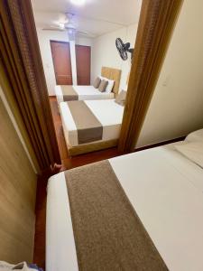 Voodi või voodid majutusasutuse Hotel Pereira Central toas