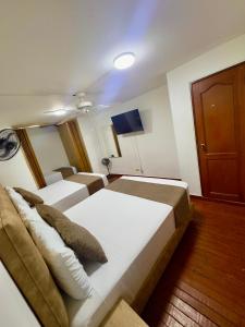 Voodi või voodid majutusasutuse Hotel Pereira Central toas