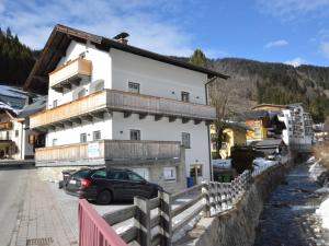 a building with a car parked in front of it at Leni Top 6 in Dienten am Hochkönig +11 photos