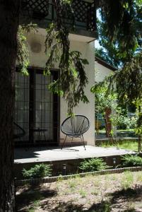 a bench sitting in front of a building at Endretro Apartments in Siófok