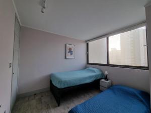 Postel nebo postele na pokoji v ubytování Modern apartment in Montemar