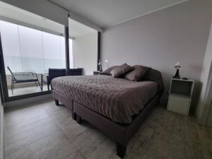 Postel nebo postele na pokoji v ubytování Modern apartment in Montemar