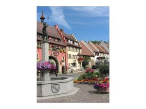 a town with a fountain in the middle of a street at 1-bedroom holiday apartment in Dittishausen