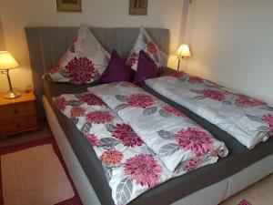 a bed with two pillows on top of it at 1-bedroom holiday apartment in Dittishausen +33 photos