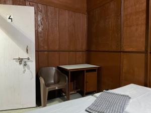 Postel nebo postele na pokoji v ubytování Mousak Lodge