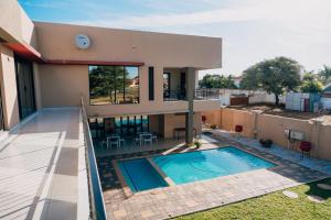 a view of a house with a swimming pool at Escapade Lux Boutique Residence in Gaborone