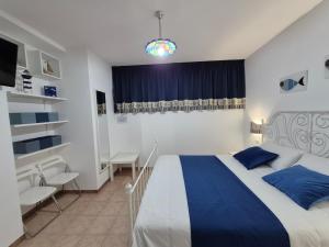 Ένα ή περισσότερα κρεβάτια σε δωμάτιο στο Torre dell'Alto apartment