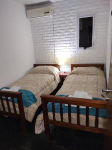 Posteľ alebo postele v izbe v ubytovaní Cabaña Lodge Araucaria ll