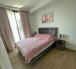 Ένα ή περισσότερα κρεβάτια σε δωμάτιο στο Аппартаменты Sky Park Laguna Phuket