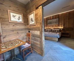 Postel nebo postele na pokoji v ubytování HIBOU Chambres - Cogne