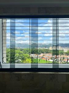 a window with a view of a city at Comfort and a perfect location in Valencia