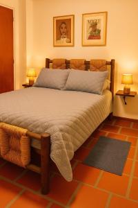 a bedroom with a large bed with two lamps at Comfort and a perfect location in Valencia +10 photos