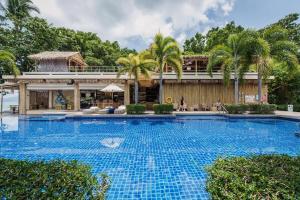 a large swimming pool in front of a building at NEW Malee Resort Studio 858 in Rawai Beach