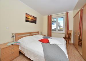 Postel nebo postele na pokoji v ubytování Ferienwohnung "Ostseebrise"