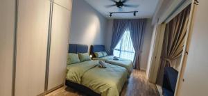 a bedroom with a bed and a large window at Sunway Geo Suites CA0F at Sunway City by Ezprop in Subang Jaya