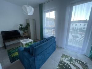 Posezení v ubytování Apartament z tarasem przy lesie Reda
