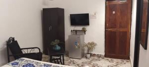 TV a/nebo společenská místnost v ubytování Casa Anjo