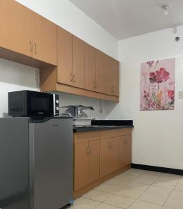 Kuchyň nebo kuchyňský kout v ubytování Unit in cypress tower taguig
