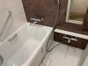 Koupelna v ubytování HOTEL BRILLIO ASAKUSABASHI