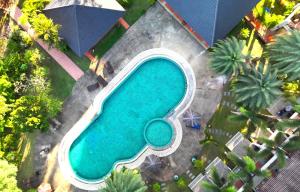 an overhead view of a swimming pool with palm trees at Chang Buri Resort & Koh Chang Hillside in Ko Chang