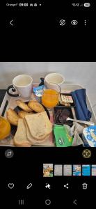 a tray of food with bread and two cups of coffee at Le Sud, pdcompri in Toulon