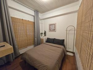 Postel nebo postele na pokoji v ubytování Simoy Staycation Tagaytay