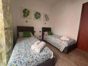 En eller flere senge i et værelse på La Casa di Eva