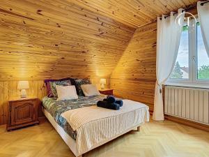 a bedroom with a bed with a teddy bear on it at Au murmure de l eau in Ebersheim