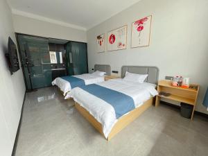 Postel nebo postele na pokoji v ubytování 少东家公馆二号院 + 13 fotografií