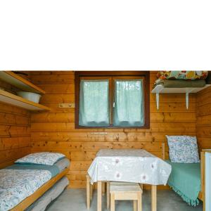 Posteľ alebo postele v izbe v ubytovaní Camping Sérendipité