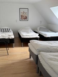 Postel nebo postele na pokoji v ubytování Guesthouse Hune
