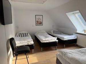 Postel nebo postele na pokoji v ubytování Guesthouse Hune