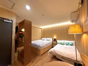 TOKYO SKYTREE HOUSE-Multiple room stylesにあるベッド