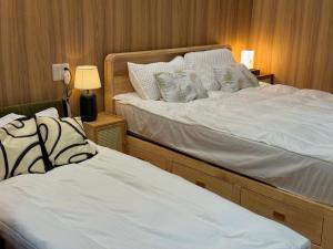 TOKYO SKYTREE HOUSE-Multiple room stylesにあるベッド