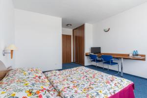 Łóżko lub łóżka w pokoju w obiekcie La Residence Kasandra