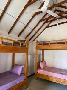 Postel nebo postele na pokoji v ubytování Bliss Cabana