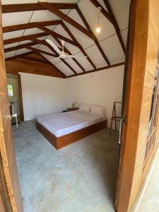 Voodi või voodid majutusasutuse Bliss Cabana toas