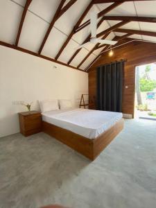 Voodi või voodid majutusasutuse Bliss Cabana toas