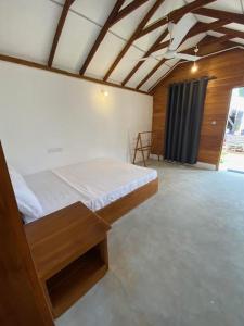 Voodi või voodid majutusasutuse Bliss Cabana toas