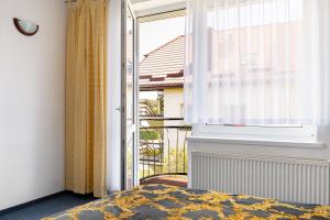 Łóżko lub łóżka w pokoju w obiekcie La Residence Kasandra