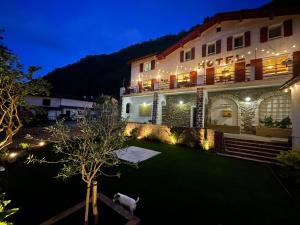 a view of a hotel at night with lights at Clementenia - Maison d'hôtes in Arnéguy