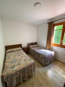 Postel nebo postele na pokoji v ubytování Apartamentos