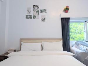A bed or beds in a room at A-Lang Homestay