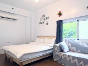 A bed or beds in a room at A-Lang Homestay