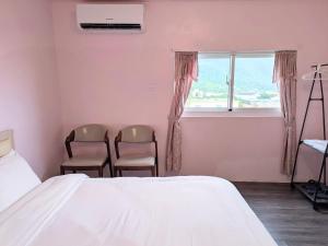 A bed or beds in a room at A-Lang Homestay