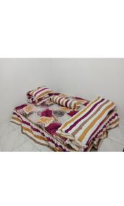 a pile of towels sitting on top of a table at Jojo Komodo Homestay in Komodo +98 photos