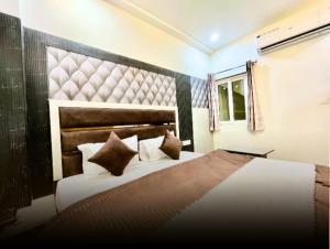 Giường trong phòng chung tại Hotel kanisha stay